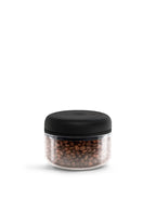 Clear glass Fellow Atmos canister preserving coffee freshness